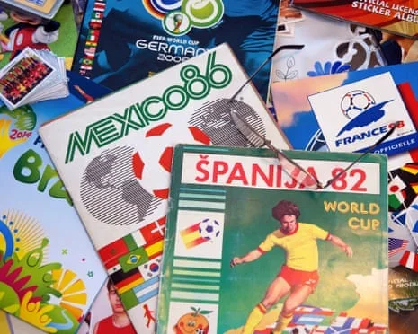 Several vintage World Cup sticker albums including Mexico 86, Spain 82, and Germany 2006 spread on a surface
